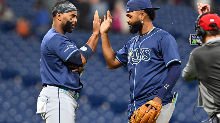 CLEVELAND, OHIO - AUGUST 25: Yandy Díaz #2 and Junior Caminero #13 of the Tampa Bay Rays celebrate after the Rays defeated the Cleveland Guardians at Progressive Field on August 25, 2025 in Cleveland, Ohio. The Rays defeated the Guardians 9-0. (Photo by Jason Miller/Getty Images)