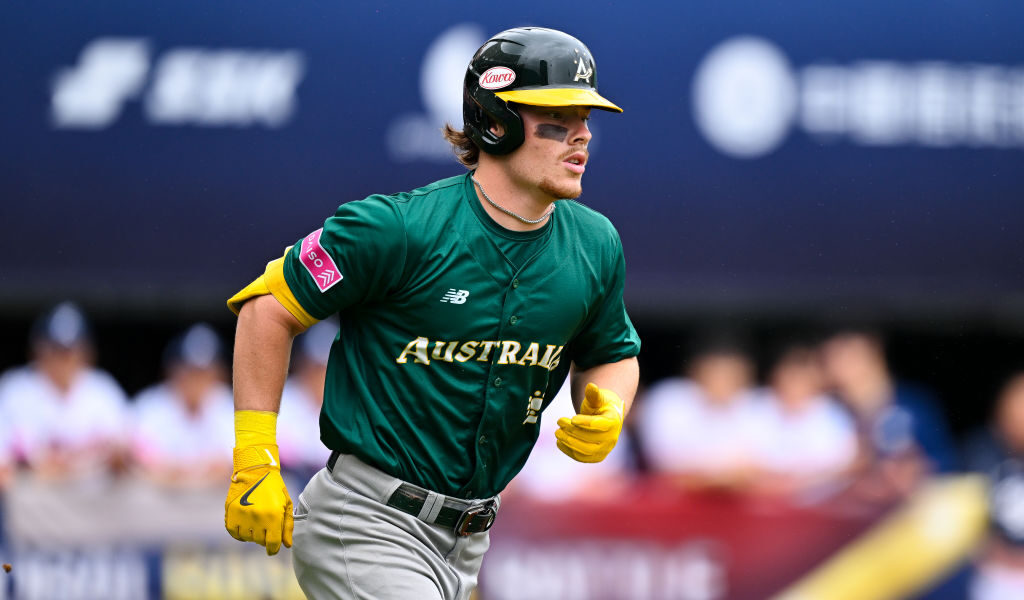 TAIPEI, TAIWAN - NOVEMBER 18: Travis Bazzana #4 of Team Australia reacts after hitting in the top of the first inning during the WBSC Premier12 Opening Round Group B game between Australia and South Korea at Taipei Tianmu Baseball Stadium on November 18, 2024 in Taipei, Taiwan. (Photo by Gene Wang/Getty Images)