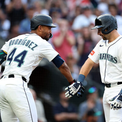 SEATTLE, WASHINGTON - AUGUST 25: Cal Raleigh #29 of the Seattle Mariners celebrates after his solo home run, his 50th of the regular season, with Julio Rodríguez #44 against the San Diego Padres during the first inning at T-Mobile Park on August 25, 2025 in Seattle, Washington. (Photo by Steph Chambers/Getty Images)