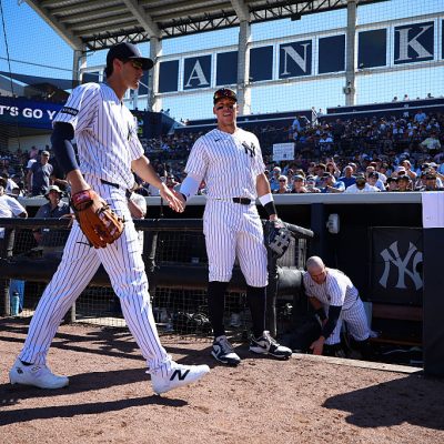 TAMPA, FL - FEBRUARY 21: Spencer Jones #78 and Aaron Judge #99 of the New York Yankees high five during the game against the Detroit Tigers at George M. Steinbrenner Field on February 21, 2026 in Tampa, Florida. (Photo by New York Yankees/Getty Images)
