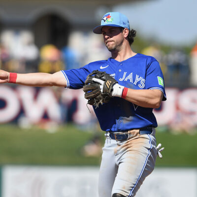 LAKELAND, FLORIDA - FEBRUARY 25: Ernie Clement #22 of the Toronto Blue Jays throws a runner out at first during a spring training game against the Detroit Tigers at Publix Field at Joker Marchant Stadium on February 25, 2026 in Lakeland, Florida. (Photo by Mark Taylor/Getty Images)