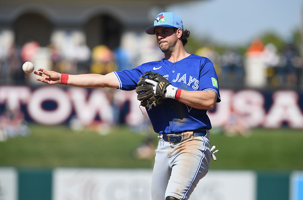 LAKELAND, FLORIDA - FEBRUARY 25: Ernie Clement #22 of the Toronto Blue Jays throws a runner out at first during a spring training game against the Detroit Tigers at Publix Field at Joker Marchant Stadium on February 25, 2026 in Lakeland, Florida. (Photo by Mark Taylor/Getty Images)