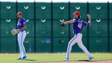 SURPRISE, ARIZONA - MARCH 6: Jacob deGrom (R) #48 of the Texas Rangers participates in a throwing drill with Nathan Eovaldi #17 prior to a Spring Training game against the Seattle Mariners at Surprise Stadium on March 6, 2026 in Surprise, Arizona. (Photo by Brandon Sloter/Getty Images)