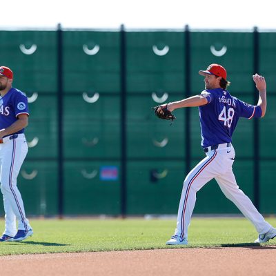 SURPRISE, ARIZONA - MARCH 6: Jacob deGrom (R) #48 of the Texas Rangers participates in a throwing drill with Nathan Eovaldi #17 prior to a Spring Training game against the Seattle Mariners at Surprise Stadium on March 6, 2026 in Surprise, Arizona. (Photo by Brandon Sloter/Getty Images)