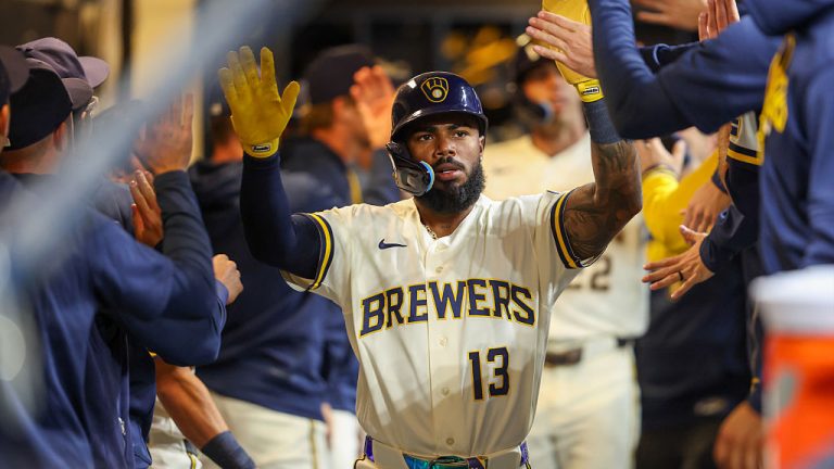 MILWAUKEE, WI - MARCH 23: Luis Rengifo #13 pf the Milwaukee Brewers celebrates with teammates in the dugout after scoring in the second inning during the game between the Cincinnati Reds and the Milwaukee Brewers at American Family Field on Monday, March 23, 2026 in Milwaukee, Wisconsin. (Photo by Kylie Bridenhagen/MLB Photos via Getty Images)