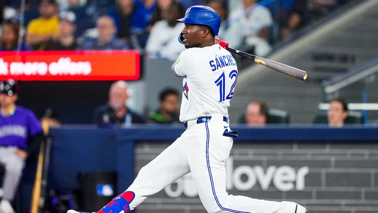 TORONTO, CANADA - MARCH 30: Jesus Sanchez #12 of the Toronto Blue Jays hits a hits a single against the Colorado Rockies during the first inning in their MLB game at Rogers Centre on March 30, 2026 in Toronto, Ontario, Canada. (Photo by Mark Blinch/Getty Images)
