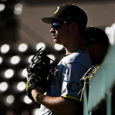 STANFORD, CALIFORNIA - APRIL 19: Ryan Cooney #12 of the Oregon Ducks looks on during warm ups before their game against the Stanford Cardinal at Klein Field at Sunken Diamond on April 19, 2024 in Stanford, California. (Photo by Eakin Howard/Getty Images)