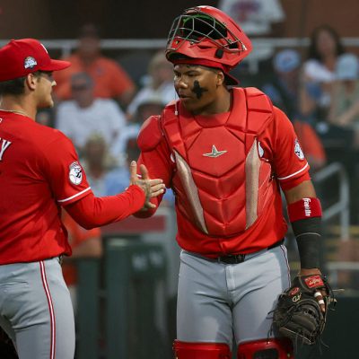 SCOTTSDALE, AZ - MARCH 19: Chase Petty #61 high-fives Alfredo Duno #6 of the Cincinnati Reds during the game between the Cincinnati Reds and the San Francisco Giants at Scottsdale Stadium on Thursday, March 19, 2026 in Scottsdale, Arizona. (Photo by Rob Leiter/MLB Photos via Getty Images)