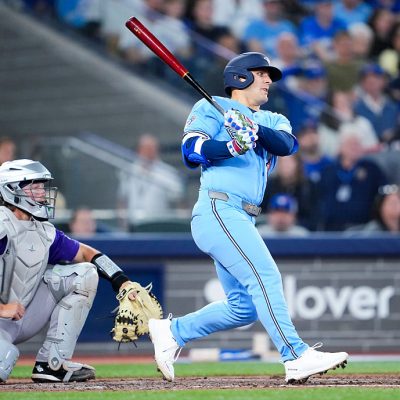TORONTO, CANADA - MARCH 31: Daulton Varsho #5 of the Toronto Blue Jays swings against the Colorado Rockies during the seventh inning in their MLB game at Rogers Centre on March 31, 2026 in Toronto, Ontario, Canada. (Photo by Mark Blinch/Getty Images)