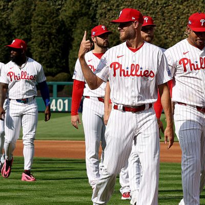 PHILADELPHIA, PENNSYLVANIA - MARCH 26: Zack Wheeler #45 of the Philadelphia Phillies and teammates walk to the dugout on Opening Day against the Texas Rangers at Citizens Bank Park on March 26, 2026 in Philadelphia, Pennsylvania. (Photo by Emilee Chinn/Getty Images)