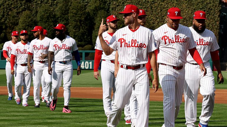 PHILADELPHIA, PENNSYLVANIA - MARCH 26: Zack Wheeler #45 of the Philadelphia Phillies and teammates walk to the dugout on Opening Day against the Texas Rangers at Citizens Bank Park on March 26, 2026 in Philadelphia, Pennsylvania. (Photo by Emilee Chinn/Getty Images)