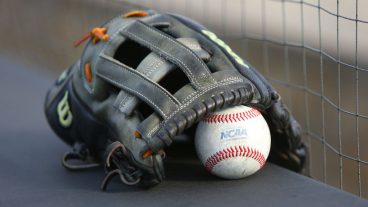 LEXINGTON, KY - JUNE 09: A glove and NCAA baseball rest on a ledge before an NCAA super regional game at Kentucky Proud Park in Lexington, KY. (Photo by Jeff Moreland/Icon Sportswire via Getty Images)