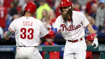 PHILADELPHIA, PENNSYLVANIA - SEPTEMBER 27: Edmundo Sosa #33 and Brandon Marsh #16 of the Philadelphia Phillies react following a solo home run hit by Sosa during the fifth inning against the Pittsburgh Pirates at Citizens Bank Park on September 27, 2023 in Philadelphia, Pennsylvania. (Photo by Tim Nwachukwu/Getty Images)