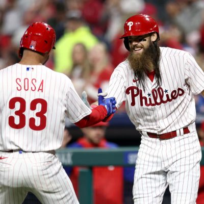 PHILADELPHIA, PENNSYLVANIA - SEPTEMBER 27: Edmundo Sosa #33 and Brandon Marsh #16 of the Philadelphia Phillies react following a solo home run hit by Sosa during the fifth inning against the Pittsburgh Pirates at Citizens Bank Park on September 27, 2023 in Philadelphia, Pennsylvania. (Photo by Tim Nwachukwu/Getty Images)