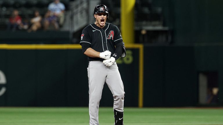 ARLINGTON, TEXAS - MAY 13: Nolan Arenado #28 of the Arizona Diamondbacks reacts to an RBI double during the ninth inning against the Texas Rangers at Globe Life Field on May 13, 2026 in Arlington, Texas. (Photo by Stacy Revere/Getty Images)