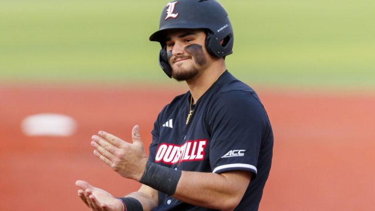 Louisville's Tague Davis celebrates on the bases.