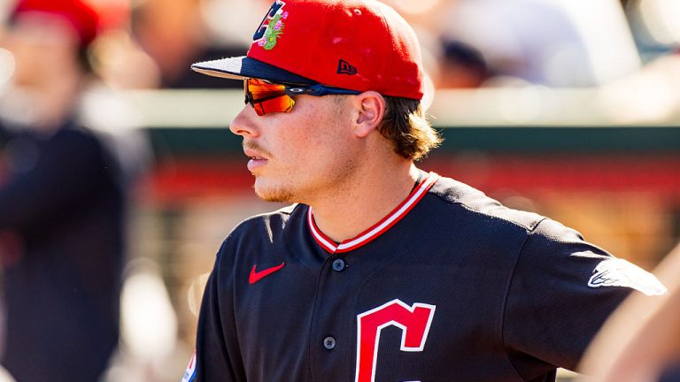 TEMPE, ARIZONA - MARCH 13: Travis Bazzana #72 of the Cleveland Guardians stands in the dugout during the Spring Training game against the Los Angeles Angels at Tempe Diablo Stadium on March 13, 2026 in Tempe, Arizona. (Photo by John E. Moore III/Getty Images)
