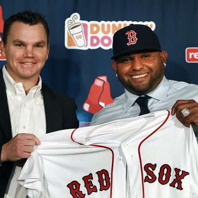 BOSTON - NOVEMBER 25: The Boston Red Sox introduced newly signed third baseman Pablo Sandoval, right, at a press conference at Fenway Park. Sandoval holding up his new jersey with general manager Ben Cherington, left. A World Series ring from his days with the San Francisco Giants is on his left hand. (Photo by Jim Davis/The Boston Globe via Getty Images)