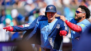 TORONTO, CANADA - JUNE 7: Yohendrick Piñango #24 of the Toronto Blue Jays puts on the home run jacket on Brandon Valenzuela #59 of the Toronto Blue Jays during the eighth inning against the Baltimore Orioles at Rogers Centre on June 7, 2026 in Toronto, Canada. (Photo by Kevin Sousa/Getty Images)