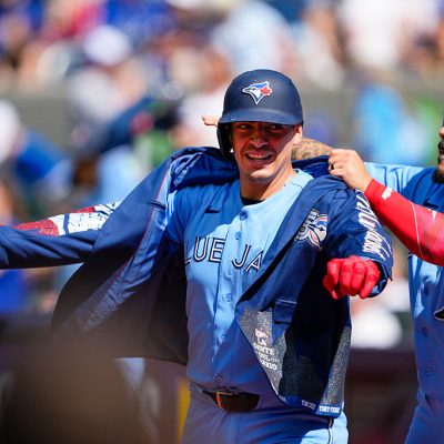 TORONTO, CANADA - JUNE 7: Yohendrick Piñango #24 of the Toronto Blue Jays puts on the home run jacket on Brandon Valenzuela #59 of the Toronto Blue Jays during the eighth inning against the Baltimore Orioles at Rogers Centre on June 7, 2026 in Toronto, Canada. (Photo by Kevin Sousa/Getty Images)