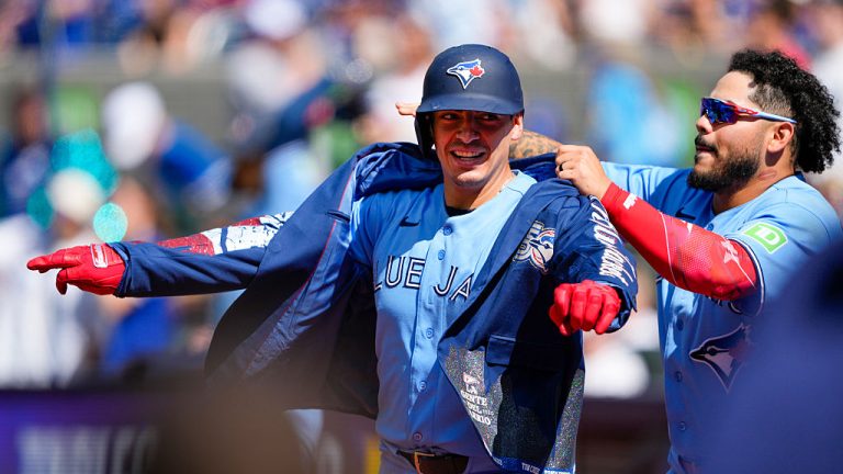 TORONTO, CANADA - JUNE 7: Yohendrick Piñango #24 of the Toronto Blue Jays puts on the home run jacket on Brandon Valenzuela #59 of the Toronto Blue Jays during the eighth inning against the Baltimore Orioles at Rogers Centre on June 7, 2026 in Toronto, Canada. (Photo by Kevin Sousa/Getty Images)