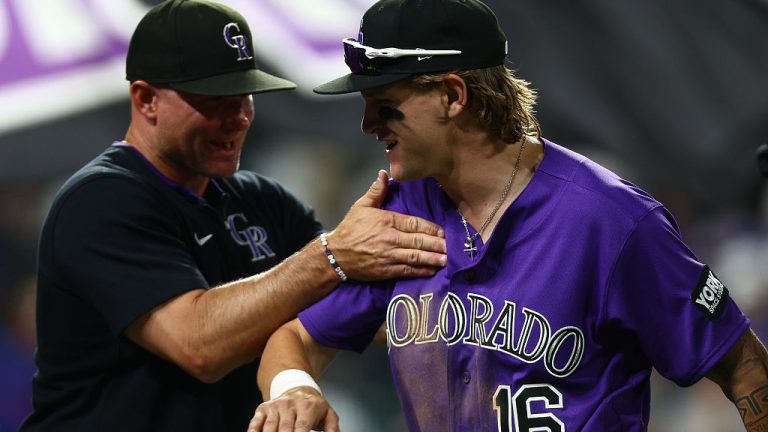 DENVER, CO - JUNE 9: Cole Carrigg #16 of the Colorado Rockies is congratulated by manager Warren Schaeffer after their 7-3 win against the Chicago Cubs at Coors Field on June 9, 2026 in Denver, Colorado. (Photo by Justin Edmonds/Getty Images)