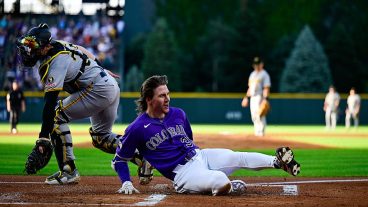 DENVER, COLORADO - JUNE 20: Jake McCarthy #31 of the Colorado Rockies slides to score after hitting a first inning inside-the-park home run against the Pittsburgh Pirates at Coors Field on June 20, 2026 in Denver, Colorado. (Photo by Dustin Bradford/Getty Images)