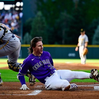 DENVER, COLORADO - JUNE 20: Jake McCarthy #31 of the Colorado Rockies slides to score after hitting a first inning inside-the-park home run against the Pittsburgh Pirates at Coors Field on June 20, 2026 in Denver, Colorado. (Photo by Dustin Bradford/Getty Images)