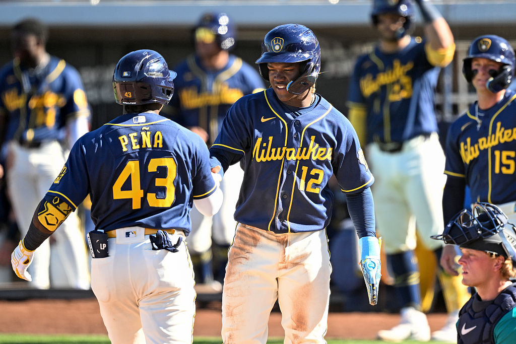 PHOENIX, ARIZONA - MARCH 20, 2026: Luis Peña #43 and Jesús Made #12 of the Milwaukee Brewers celebrate a three-run home run hit by Peña during the sixth inning of a spring training Spring Breakout game against the Seattle Mariners at American Family Fields of Phoenix on March 20, 2026 in Phoenix, Arizona. (Photo by Chris Bernacchi/Diamond Images via Getty Images)
