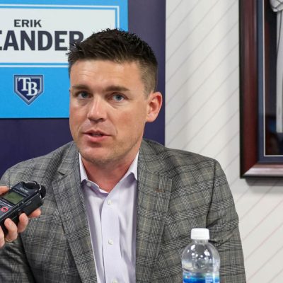 TAMPA, FL - FEBRUARY 15: President of baseball operations Erik Neander of the Tampa Bay Rays talks with a media member during the 2024 Grapefruit League Spring Training Media Day at George M. Steinbrenner Field on Thursday, February 15, 2024 in Tampa, Florida. (Photo by Mike Carlson/MLB Photos via Getty Images)