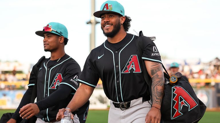 PEORIA, ARIZONA - FEBRUARY 27: Anderdson Rojas #40, left, and Manuel Peña #6 of the Arizona Diamondbacks take the field before the spring training game against the Seattle Mariners at Peoria Stadium on February 27, 2026 in Peoria, Arizona. (Photo by Mike Christy/Getty Images)