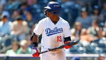 TULSA, OKLAHOMA - APRIL 19: Zyhir Hope #13 of the Tulsa Drillers looks on between pitches during a game against the Arkansas Travelers at ONEOK Field on April 19, 2026 in Tulsa, Oklahoma. (Photo by Brandon Sloter/Getty Images)