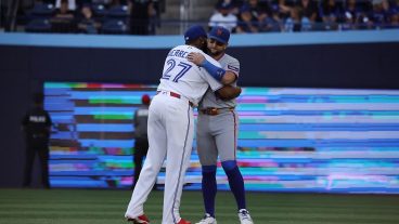 TORONTO, ON- JUNE 29 - Vladimir Guerrero Jr. #27 of the Toronto Blue Jays and Bo Bichette #19 of the New York Mets embrace as the Toronto Blue Jays play the New York Mets at Rogers Centre in Toronto. June 29, 2026. Steve Russell/Toronto Star (Steve Russell/Toronto Star via Getty Images)