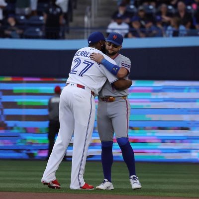 TORONTO, ON- JUNE 29 - Vladimir Guerrero Jr. #27 of the Toronto Blue Jays and Bo Bichette #19 of the New York Mets embrace as the Toronto Blue Jays play the New York Mets at Rogers Centre in Toronto. June 29, 2026. Steve Russell/Toronto Star (Steve Russell/Toronto Star via Getty Images)