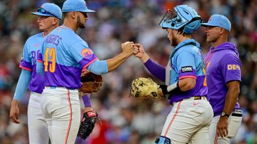DENVER, COLORADO - JULY 17: Gabriel Hughes #43 of the Colorado Rockies gets a fist bump from Hunter Goodman #15 as manager Warren Schaeffer #4 walks to the mound for a sixth inning pitching change in the game against the Cincinnati Reds at Coors Field on July 17, 2026 in Denver, Colorado. (Photo by Dustin Bradford/Getty Images)