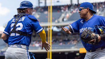 WASHINGTON, DC - JUNE 17: Carter Jensen #22 of the Kansas City Royals greets Salvador Perez #13 during an inning change in the game between the Kansas City Royals and the Washington Nationals at Nationals Park on Wednesday, June 17, 2026 in Washington, District of Columbia. (Photo by Rob Tringali/MLB Photos via Getty Images)