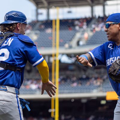 WASHINGTON, DC - JUNE 17: Carter Jensen #22 of the Kansas City Royals greets Salvador Perez #13 during an inning change in the game between the Kansas City Royals and the Washington Nationals at Nationals Park on Wednesday, June 17, 2026 in Washington, District of Columbia. (Photo by Rob Tringali/MLB Photos via Getty Images)