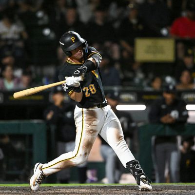 BRADENTON, FLORIDA - MARCH 20, 2026: Easton Carmichael #28 of the Pittsburgh Pirates hits a solo home run during the third inning of a spring training Spring Breakout game against the Detroit Tigers at LECOM Park on March 20, 2026 in Bradenton, Florida. (Photo by Nick Cammett/Diamond Images via Getty Images)