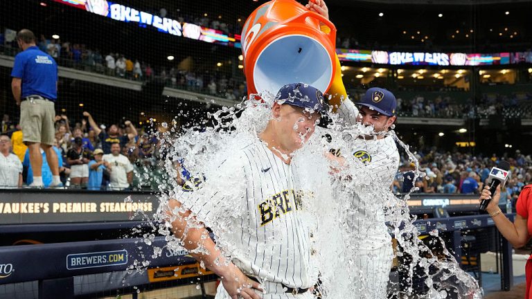 MILWAUKEE, WISCONSIN - AUGUST 08: Garrett Mitchell #5 of the Milwaukee Brewers dumps Gatorade on teammate Andrew Vaughn #28 after their team's 4-3 win over the Minnesota Twins at American Family Field on August 08, 2026 in Milwaukee, Wisconsin. (Photo by John Fisher/Getty Images)