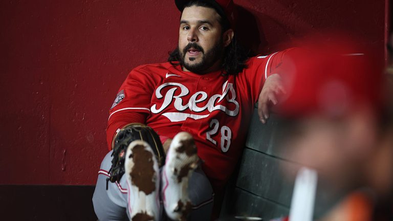 PHOENIX, ARIZONA - AUGUST 23: Eugenio Suárez #28 of the Cincinnati Reds sits in the dugout during the sixth inning of the MLB game against the Arizona Diamondbacksat Chase Field on August 23, 2026 in Phoenix, Arizona. (Photo by Christian Petersen/Getty Images)