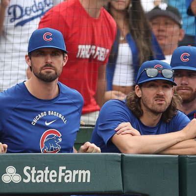CHICAGO, ILLINOIS - AUGUST 05: Clay Holmes and Kevin Gausman of the Chicago Cubs look on against the Los Angeles Dodgers at Wrigley Field on August 05, 2026 in Chicago, Illinois. (Photo by Michael Reaves/Getty Images)
