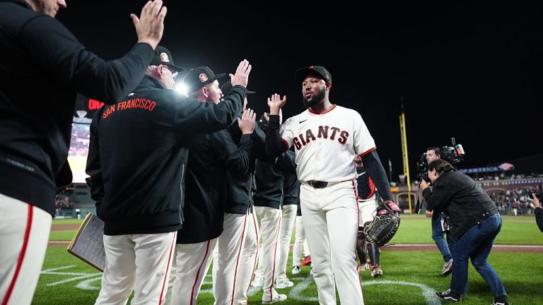SAN FRANCISCO, CALIFORNIA - AUGUST 29: Dylan Smith #66 of the San Francisco Giants high fives teammates after a win against the Arizona Diamondbacks at Oracle Park on August 29, 2026 in San Francisco, California. (Photo by Andy Kuno/San Francisco Giants/Getty Images)