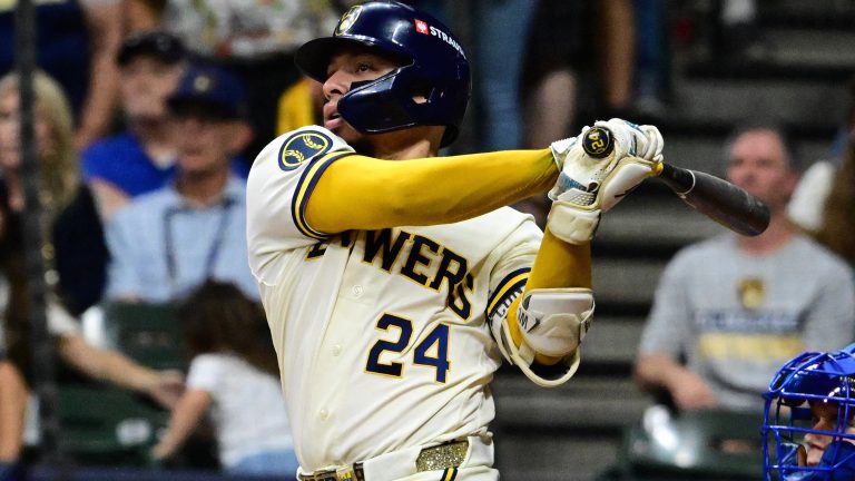 Oct 12, 2026; Milwaukee, Wisconsin, USA; Milwaukee Brewers catcher William Contreras (24) hits an RBI single against the Los Angeles Dodgers during the sixth inning in game two of the NLCS for the 2026 MLB Playoffs at American Family Field. Mandatory Credit: Benny Sieu-Imagn Images